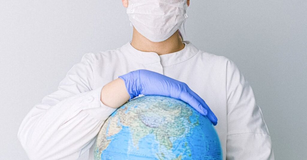 A medical professional wearing a mask and gloves holds a globe, symbolizing global health care during a pandemic.